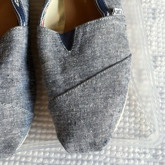 Toms denim look slip ons with navy blue and orange Aztec trim. Size 7 - Picture 2 of 8